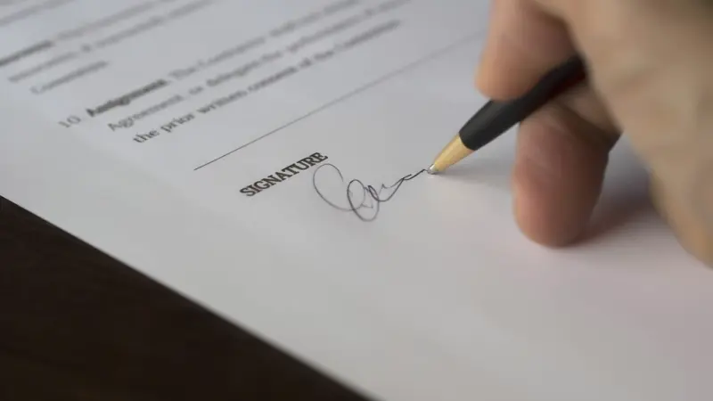 Man signing contract