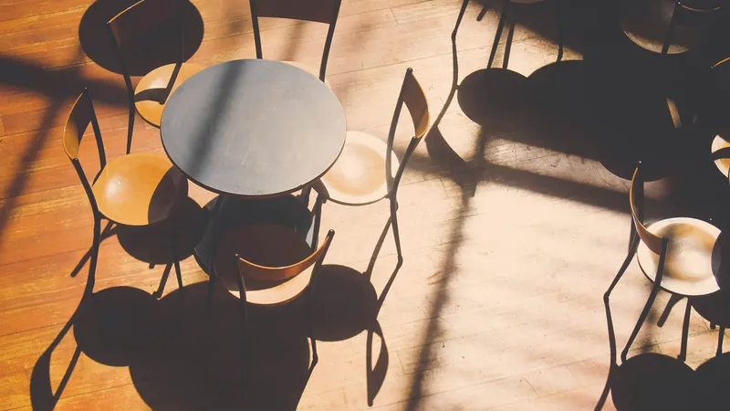 Empty cafe chairs in afternoon light
